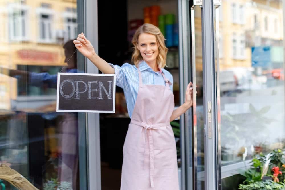 Small-Town Business Ideas, Local florist holding open sign