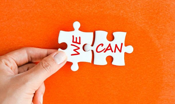 A and holding puzzle pieces that say: WE CAN.
