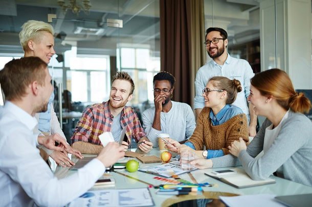 A team in a good mood at a meeting at work.