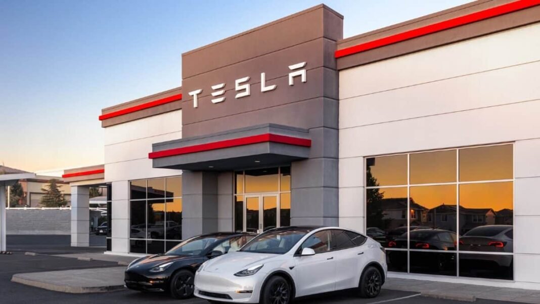 Tesla building with tesla logo and two teslas in front