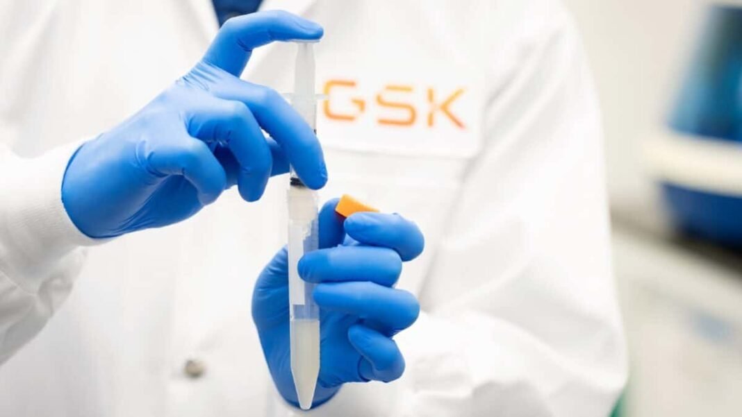 GSK scientist holding lab syringe