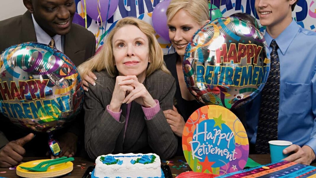 Content white businesswoman being congratulated by colleagues at her retirement party