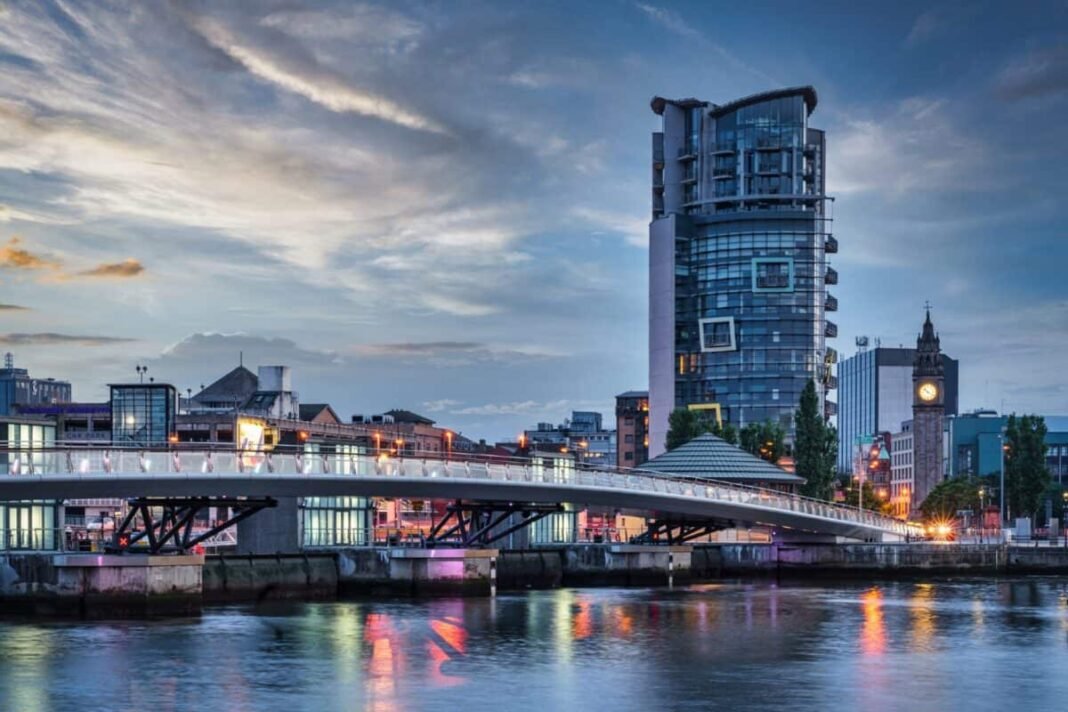 How did this little-known FTSE 250 bank grow seven times Belfast City Sunset with colorful twilight over Lagan Weir Pedestrian and Cycle Bridge spanning over the Lagan River in downtown Belfast